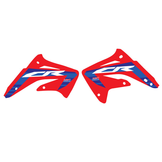 A set of red, blue, and white Honda CR85 motocross bike shroud decals.